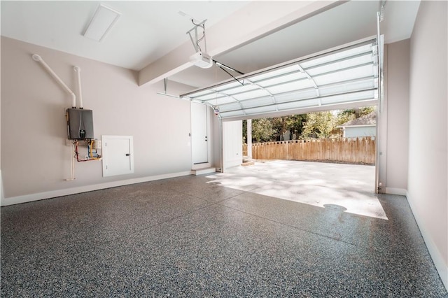 garage featuring a garage door opener and water heater