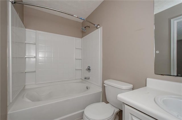 full bath with toilet, a textured ceiling, vanity, and shower / tub combination
