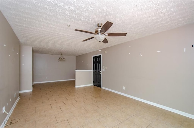 unfurnished room with baseboards, a ceiling fan, and light tile patterned flooring