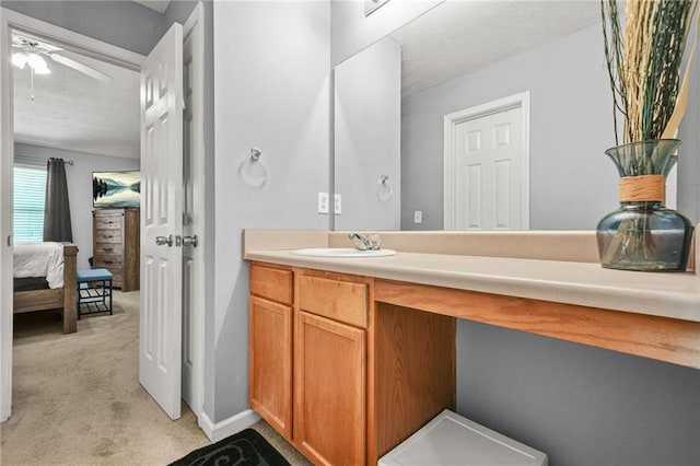30 Creek Bottom Dr, Covington, GA 30014 - bathroom with a textured ceiling, vanity, a ceiling fan, and connected bathroom