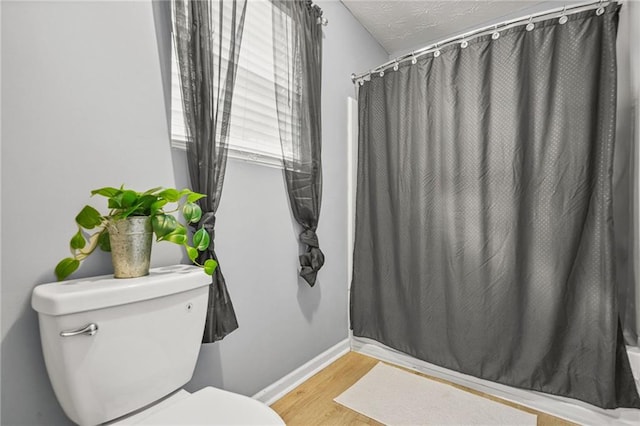 30 Creek Bottom Dr, Covington, GA 30014 - full bathroom with wood finished floors and shower / bath combo
