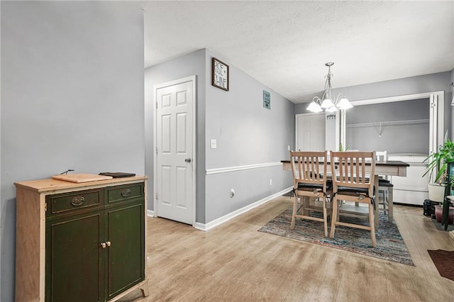 30 Creek Bottom Dr, Covington, GA 30014 - dining area with a chandelier and light wood finished floors