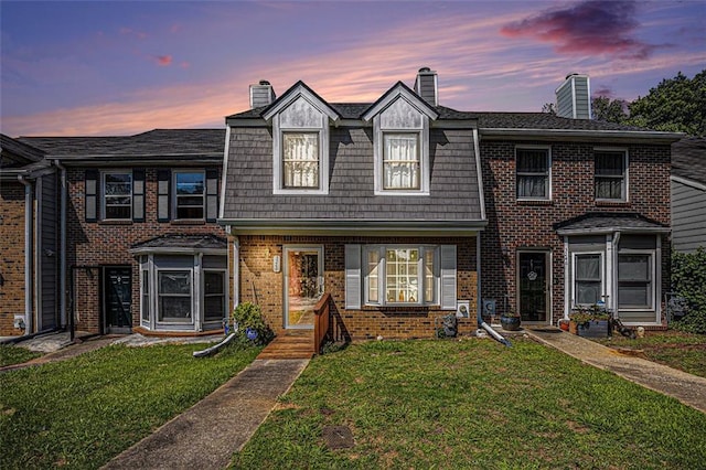 3244 Hampton Ct SE, Smyrna, GA 30082 - view of property with a chimney, a front yard, and brick siding