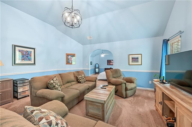 living room with visible vents, baseboards, ceiling fan with notable chandelier, high vaulted ceiling, and light carpet