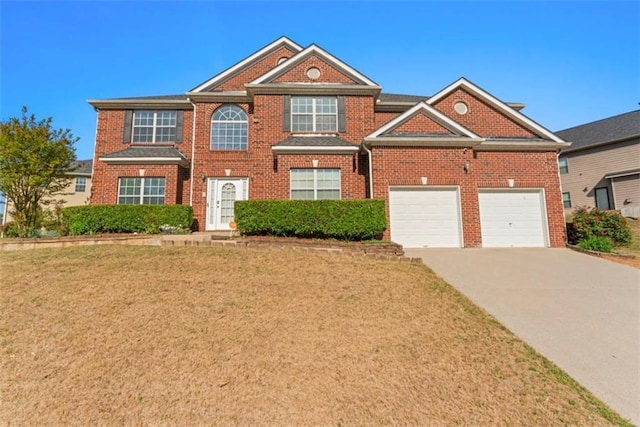 view of front of house with brick siding, driveway, and a front yard