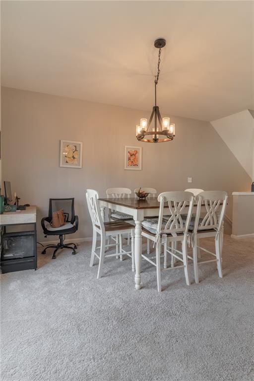 6004 Turfway Park Ct, Sugar Hill, GA 30518 - carpeted dining room with a chandelier and baseboards