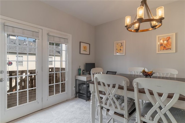 6004 Turfway Park Ct, Sugar Hill, GA 30518 - dining space with a chandelier and light colored carpet