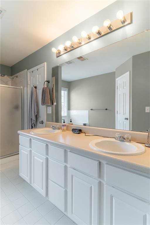 6004 Turfway Park Ct, Sugar Hill, GA 30518 - bathroom featuring double vanity, a stall shower, and tile patterned flooring