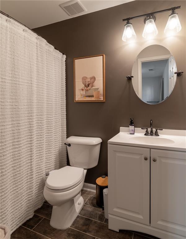 6004 Turfway Park Ct, Sugar Hill, GA 30518 - bathroom featuring toilet, vanity, a shower with curtain, and tile patterned flooring