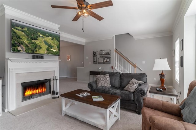 6004 Turfway Park Ct, Sugar Hill, GA 30518 - living area with crown molding, light carpet, a ceiling fan, stairs, and a lit fireplace