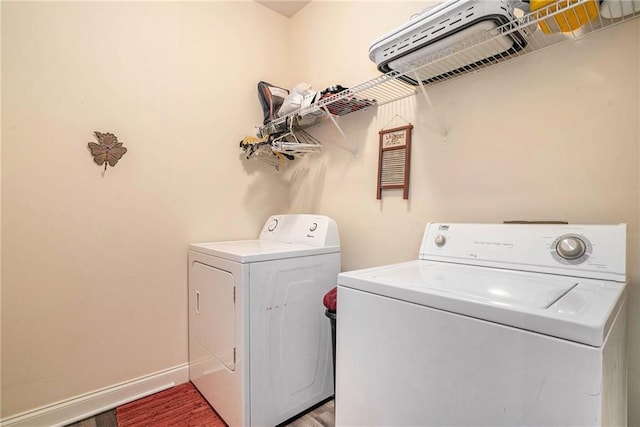 clothes washing area featuring washing machine and clothes dryer