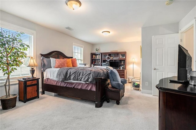 bedroom with light carpet