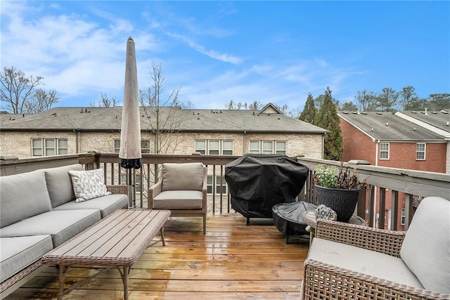 deck featuring area for grilling and outdoor lounge area