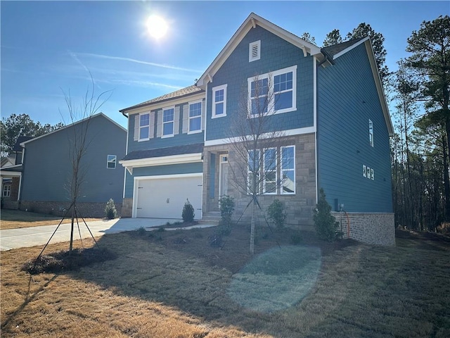 view of front facade featuring a garage and a front lawn