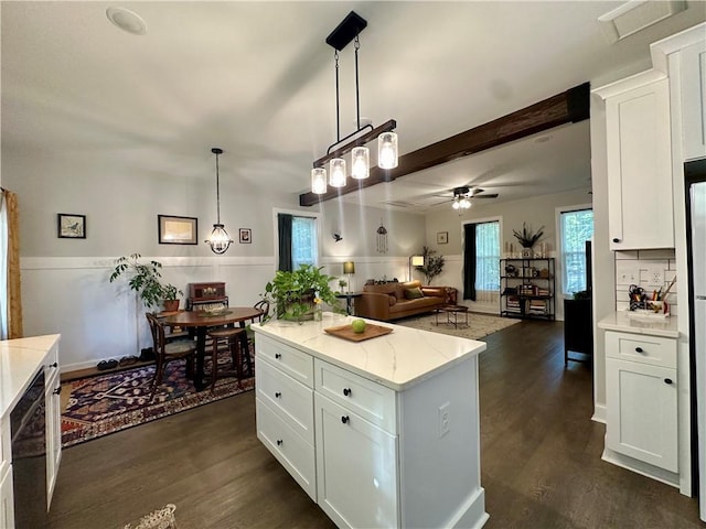 kitchen with white cabinetry, hanging light fixtures, and dark wood-type flooring