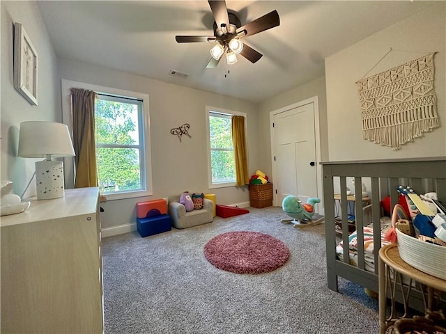 game room featuring carpet and ceiling fan