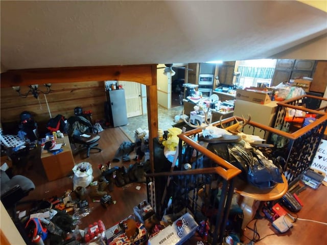 miscellaneous room with hardwood / wood-style floors and wood walls