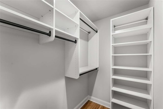 walk in closet featuring hardwood / wood-style floors