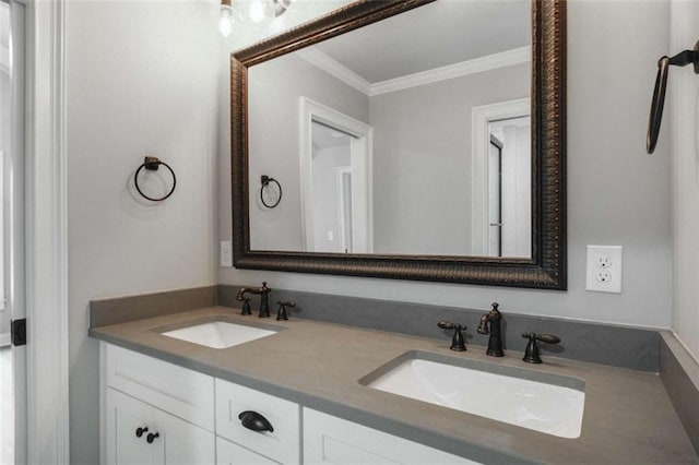 bathroom with crown molding and vanity