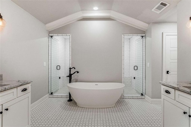 bathroom with independent shower and bath, vaulted ceiling, and vanity