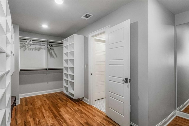 walk in closet featuring hardwood / wood-style floors