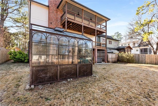 rear view of house with a balcony