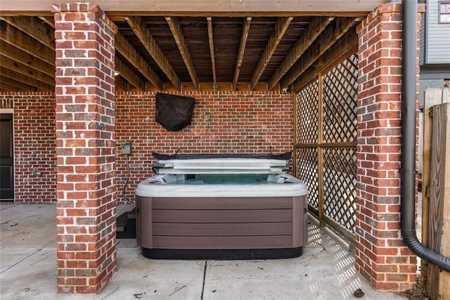 view of patio / terrace with a hot tub