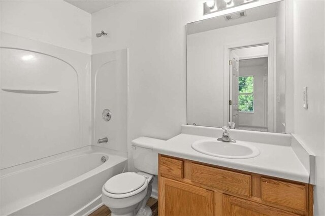 full bathroom with vanity, toilet, and tub / shower combination