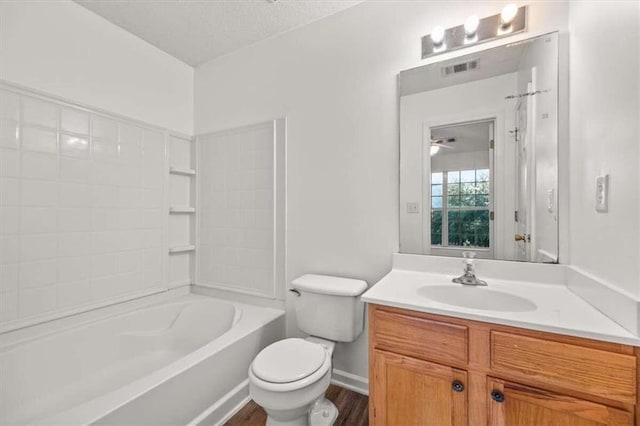 full bathroom featuring shower / tub combination, hardwood / wood-style floors, toilet, and vanity