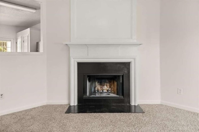 details featuring a textured ceiling and carpet floors