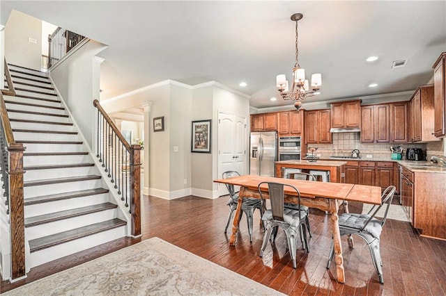 kitchen with decorative backsplash, dark hardwood / wood-style floors, stainless steel appliances, and sink