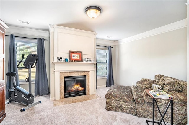 carpeted living room featuring ornamental molding