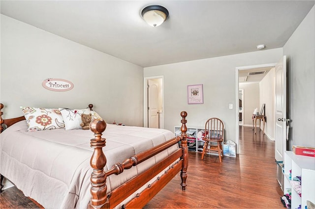 bedroom with dark hardwood / wood-style flooring