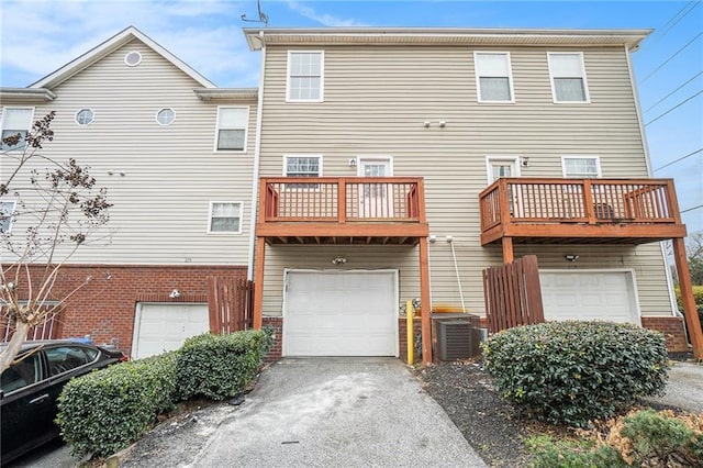 back of property with a balcony and central AC unit