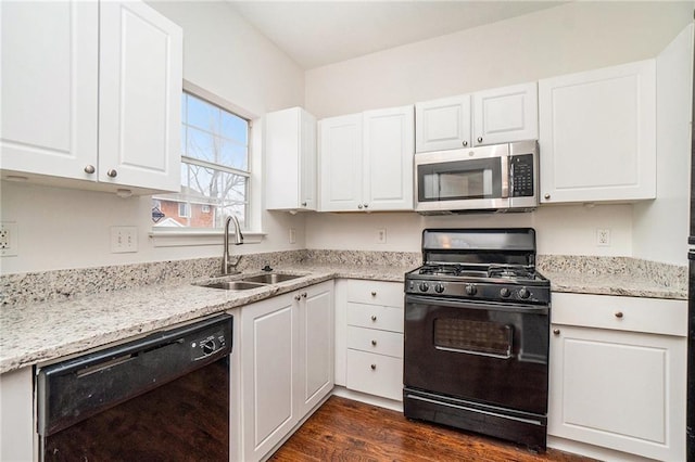 kitchen with white cabinetry, sink, dark hardwood / wood-style floors, and black appliances