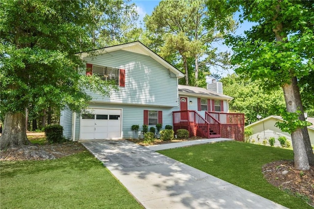 view of front of property featuring a garage and a front lawn