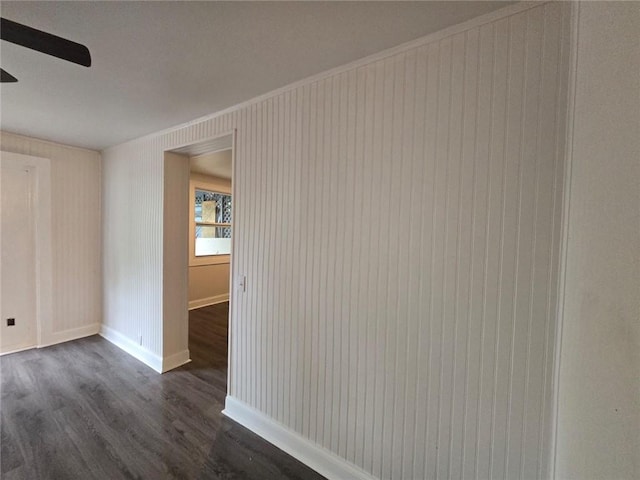 interior space featuring ceiling fan and dark wood-type flooring