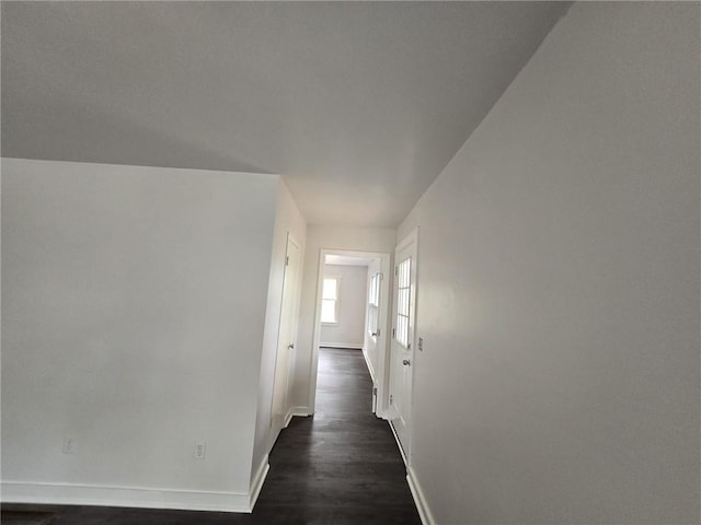 corridor with dark wood-type flooring