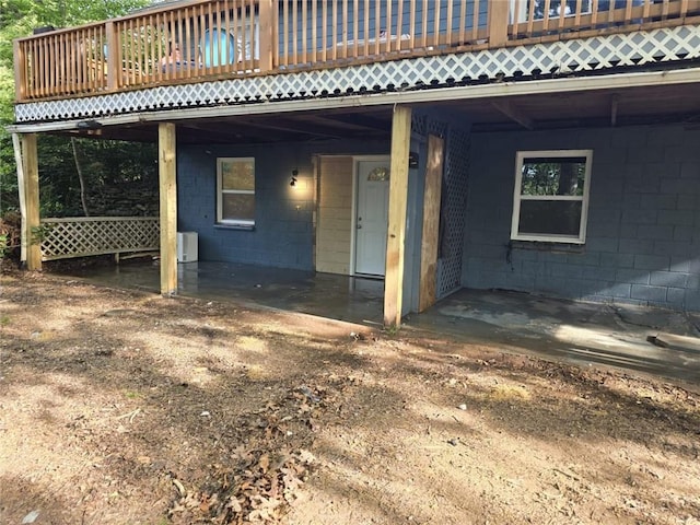 doorway to property with a wooden deck