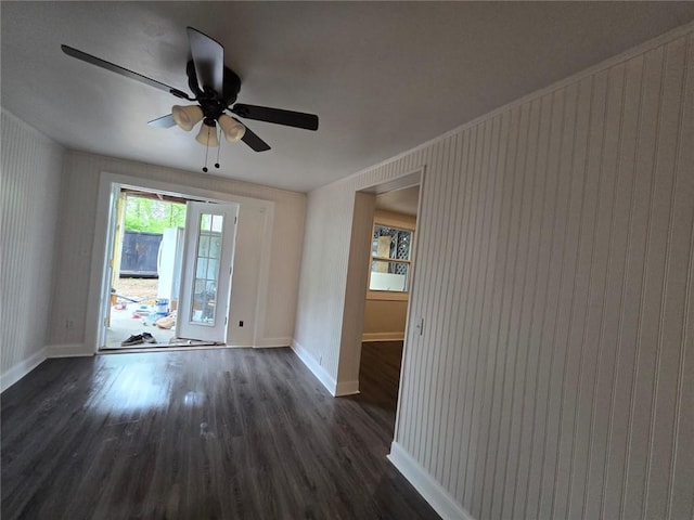 spare room featuring dark hardwood / wood-style floors and ceiling fan