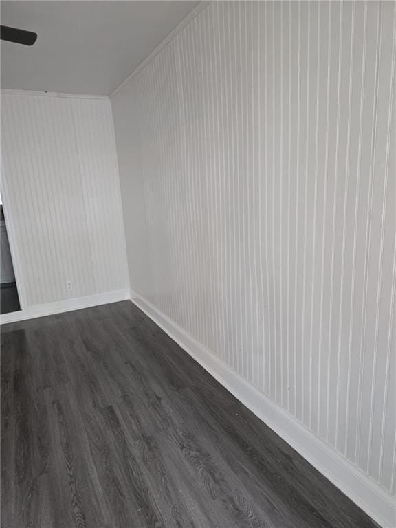 bonus room featuring ceiling fan and dark hardwood / wood-style floors