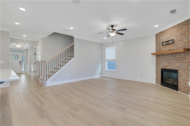 kitchen with white cabinetry, appliances with stainless steel finishes, light hardwood / wood-style floors, and decorative backsplash