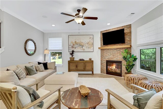 dining room with sink, ceiling fan with notable chandelier, and light hardwood / wood-style flooring