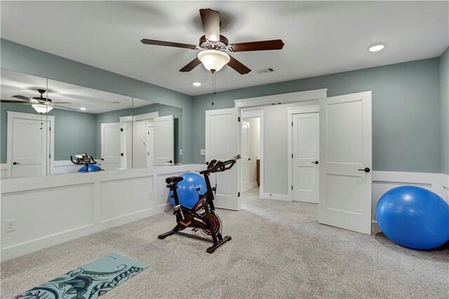 living room with light hardwood / wood-style flooring, ornamental molding, and ceiling fan