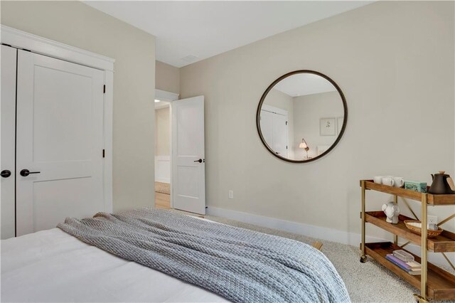 exercise room featuring light colored carpet and ceiling fan