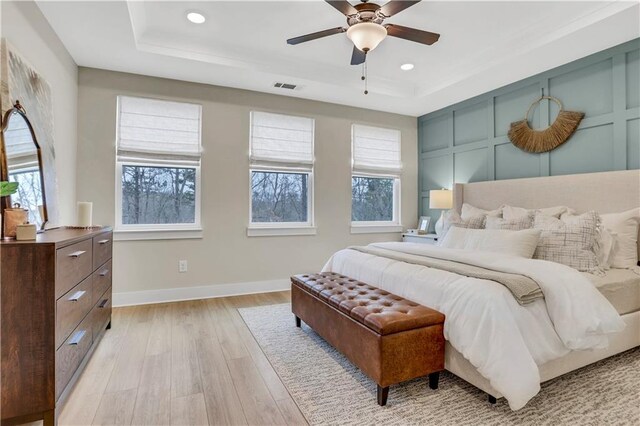 exercise room with light colored carpet and ceiling fan