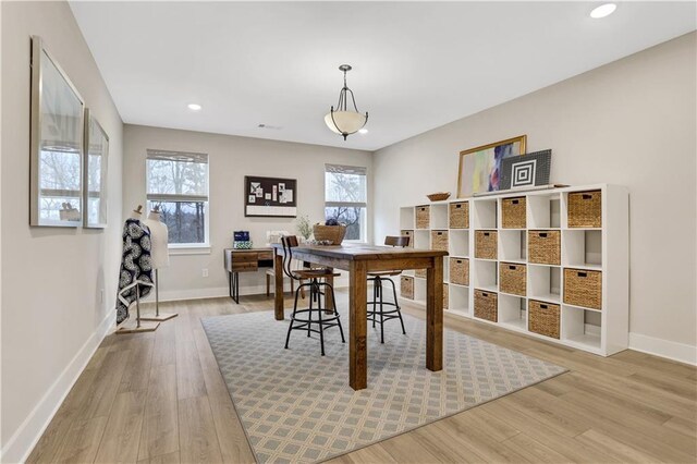 living room with ceiling fan and light wood-type flooring