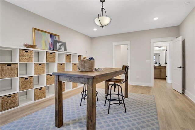 living room with ceiling fan and light wood-type flooring