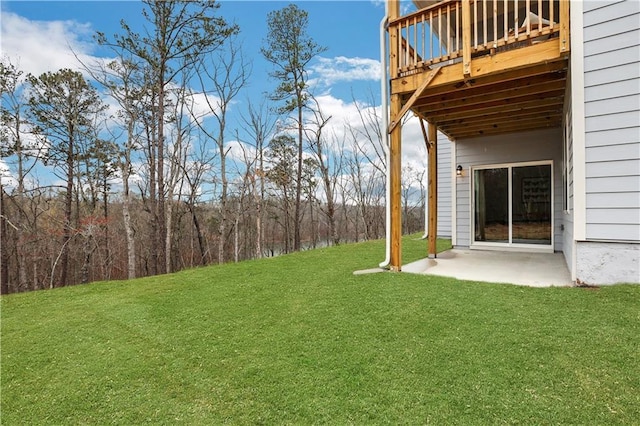 view of yard with a deck and a patio area