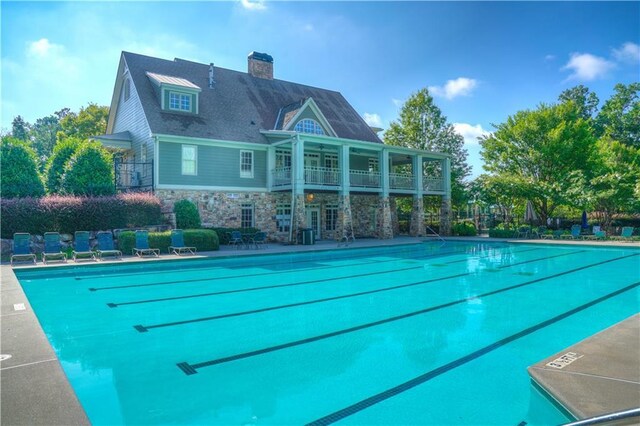 view of pool with a water slide